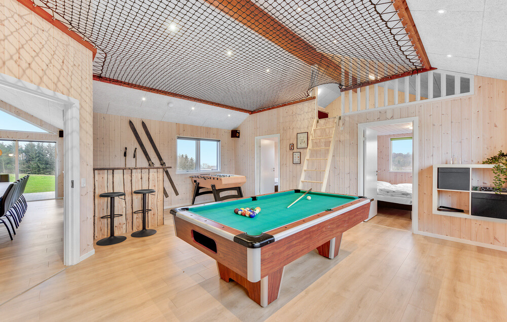 Neben den vielen schönen Stunden, die man im Poolbereich des Hauses verbringen kann, bietet das Luxusferienhaus 539 auch Spielevergnügen bei Billard/Tischtennis und Darts