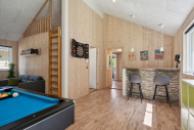 Das Luxusferienhaus 320 für 18 Personen hat einen großen Aktivitätsraum mit u. a. Billard und Darts