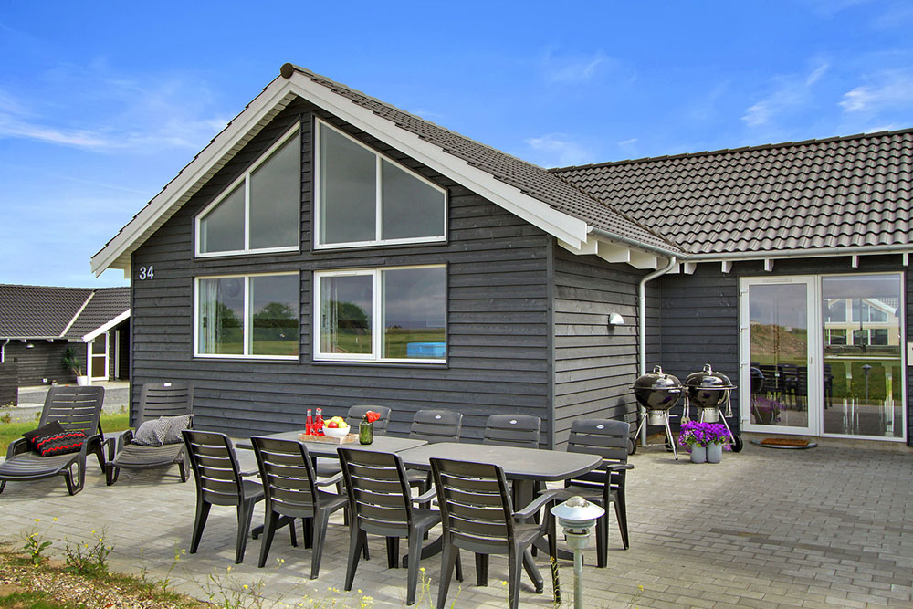 Genießen Sie einen Grillabend auf der Terrasse des Luxusferienhauses Nr. 319 in Fünen und seine Inseln