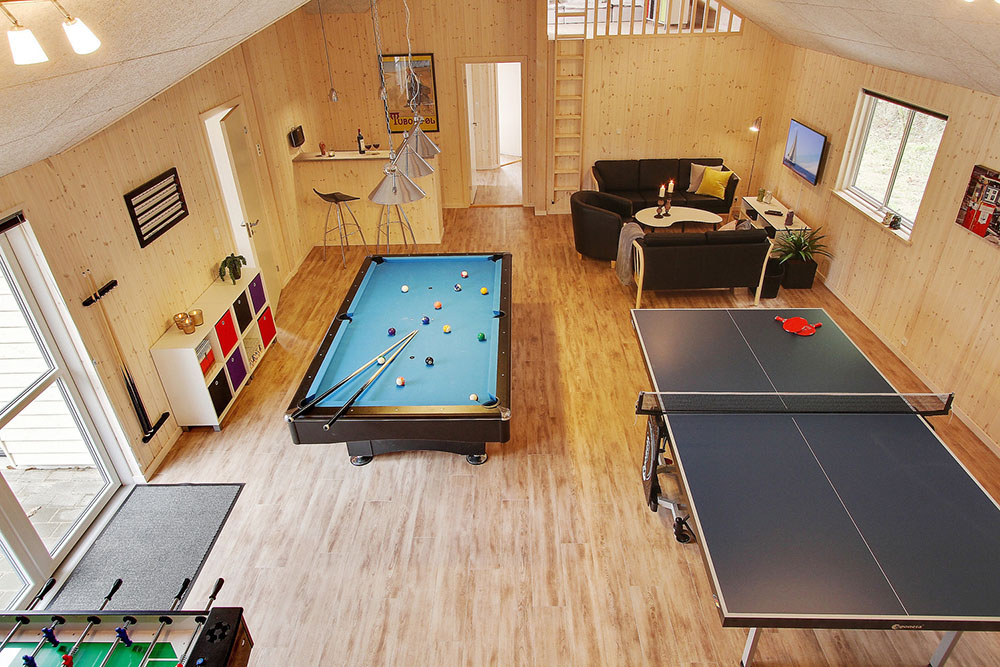 Neben den vielen schönen Stunden, die man im Poolbereich des Hauses verbringen kann, bietet das Luxusferienhaus 330 auch Spielevergnügen bei Billard/Tischtennis und Darts