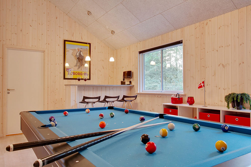 Neben den vielen schönen Stunden, die man im Poolbereich des Hauses verbringen kann, bietet das Luxusferienhaus 334 auch Spielevergnügen bei Billard/Tischtennis und Darts