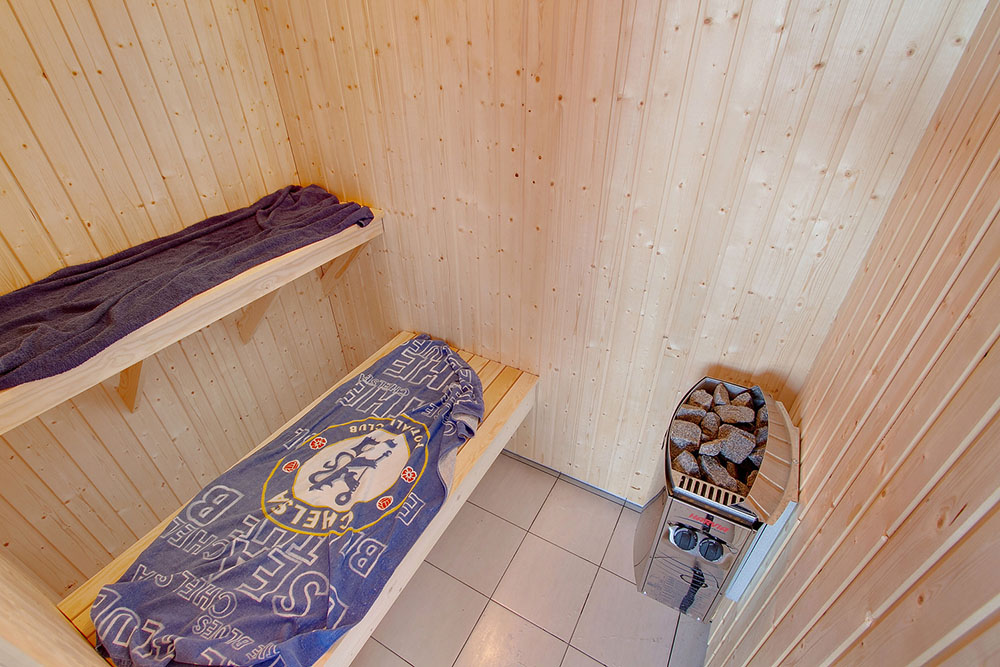 Genießen Sie die heiße Sauna im Luxusferienhaus Nr. 334 für 16 Personen