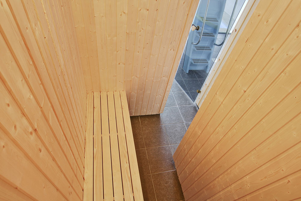 Genießen Sie die heiße Sauna im Luxusferienhaus Nr. 341 für 14 Personen