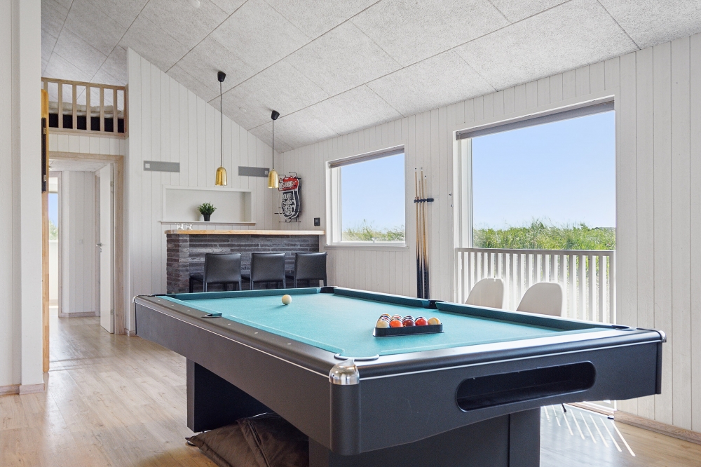 Neben den vielen schönen Stunden, die man im Poolbereich des Hauses verbringen kann, bietet das Luxusferienhaus 348 auch Spielevergnügen bei Billard/Tischtennis und Darts