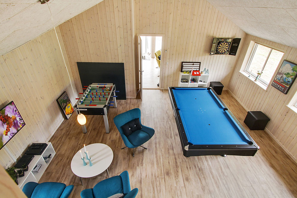 Neben den vielen schönen Stunden, die man im Poolbereich des Hauses verbringen kann, bietet das Luxusferienhaus 355 auch Spielevergnügen bei Billard/Tischtennis und Darts