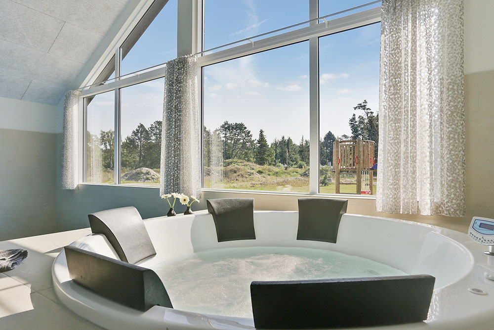 Genießen Sie den warmen Whirlpool im Luxusferienhaus Nr. 369 in Nordseeland