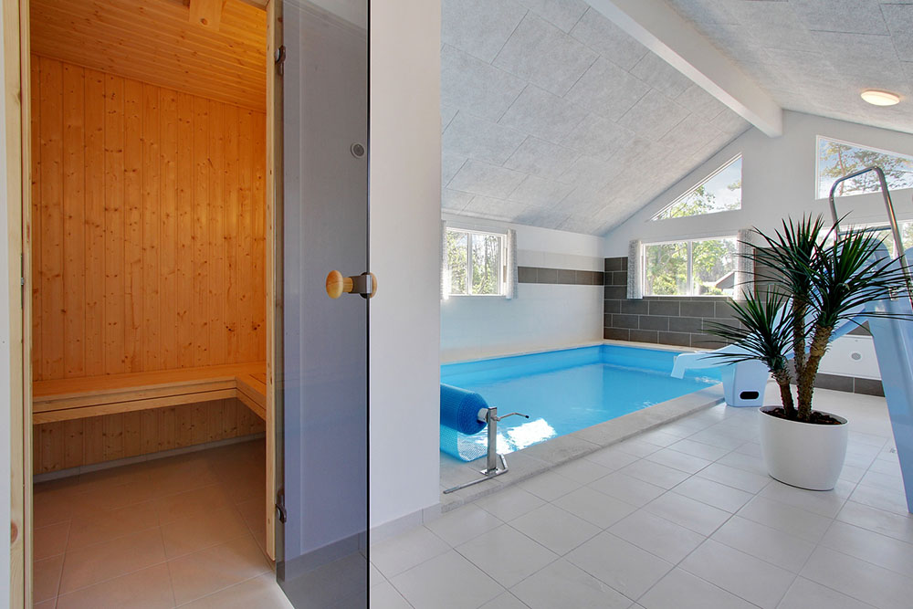 Genießen Sie die heiße Sauna im Luxusferienhaus Nr. 374 für 22 Personen
