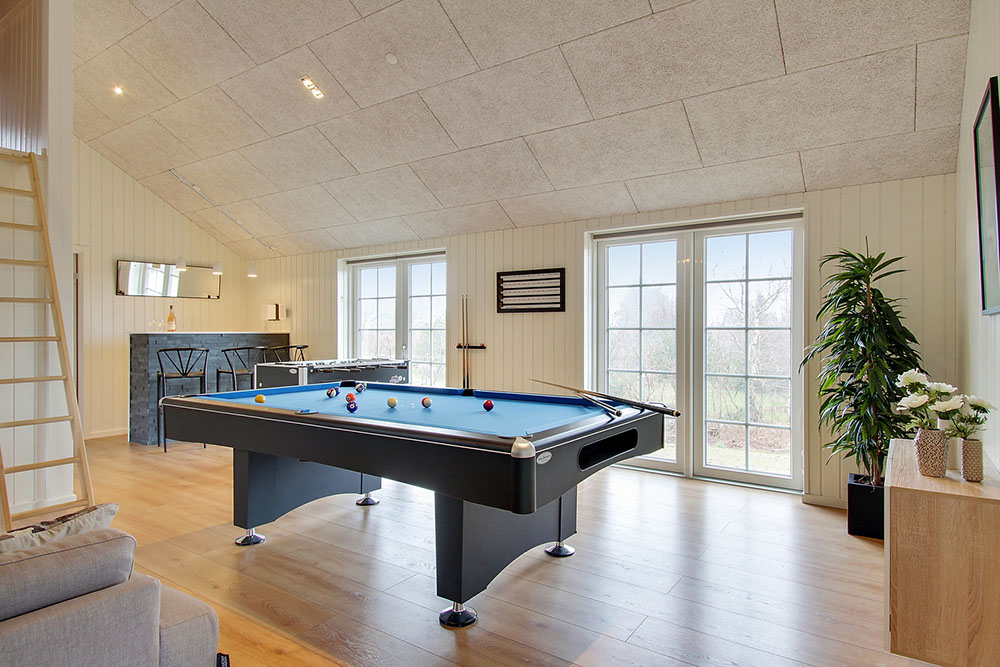Neben den vielen schönen Stunden, die man im Poolbereich des Hauses verbringen kann, bietet das Luxusferienhaus 386 auch Spielevergnügen bei Billard/Tischtennis und Darts