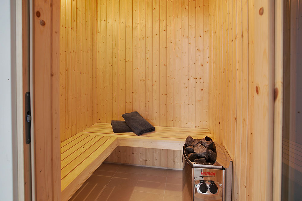 Genießen Sie die heiße Sauna im Luxusferienhaus Nr. 387 für 24 Personen