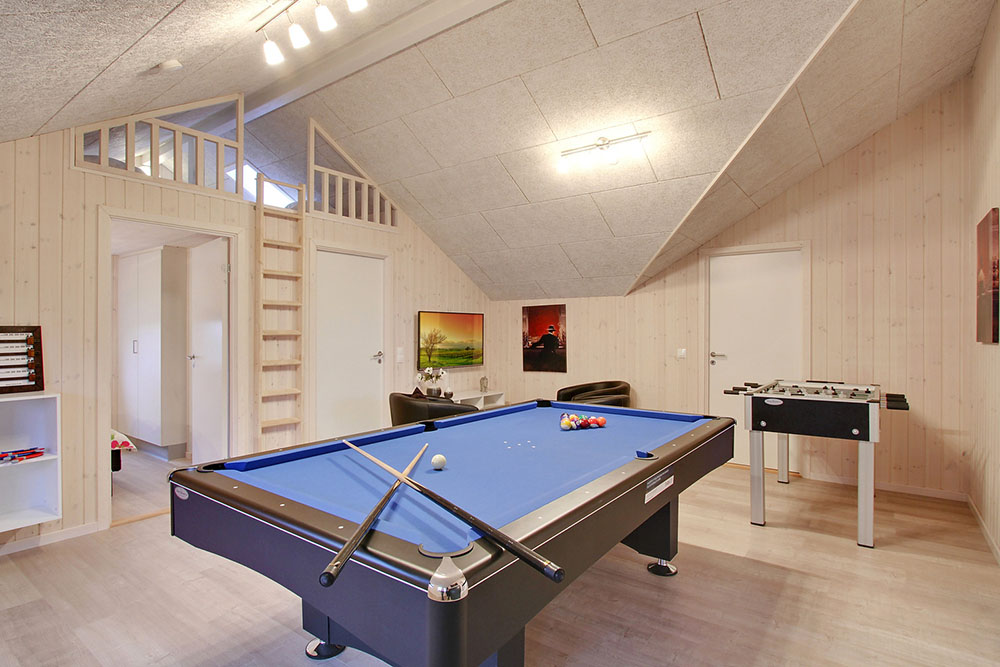 Neben den vielen schönen Stunden, die man im Poolbereich des Hauses verbringen kann, bietet das Luxusferienhaus 702 auch Spielevergnügen bei Billard/Tischtennis und Darts