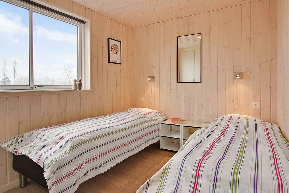 Eines der 8 Schlafzimmer im Luxusferienhaus Nr. 703