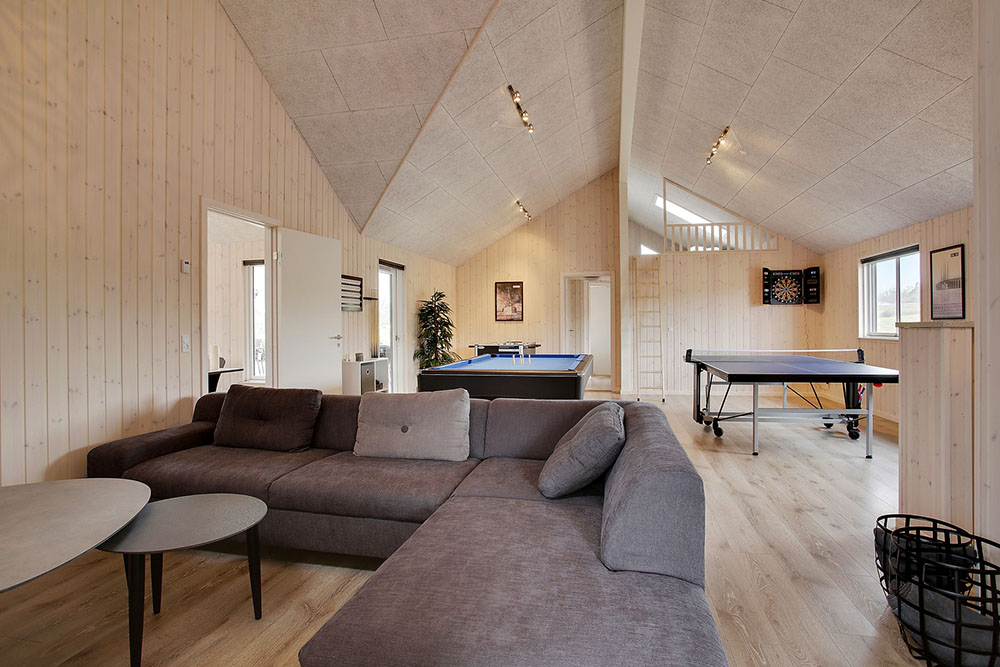 Aktivitätsraum im Luxusferienhaus Nr. 395 mit 8 Schlafzimmern und Platz für 20 Gäste.