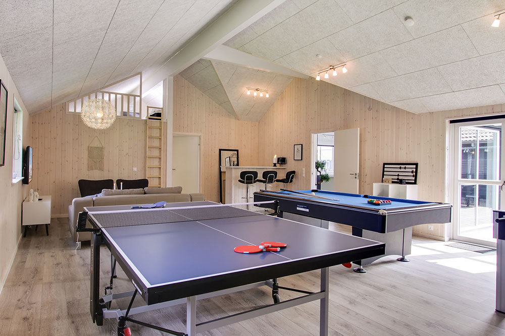 Neben den vielen schönen Stunden, die man im Poolbereich des Hauses verbringen kann, bietet das Luxusferienhaus 714 auch Spielevergnügen bei Billard/Tischtennis und Darts