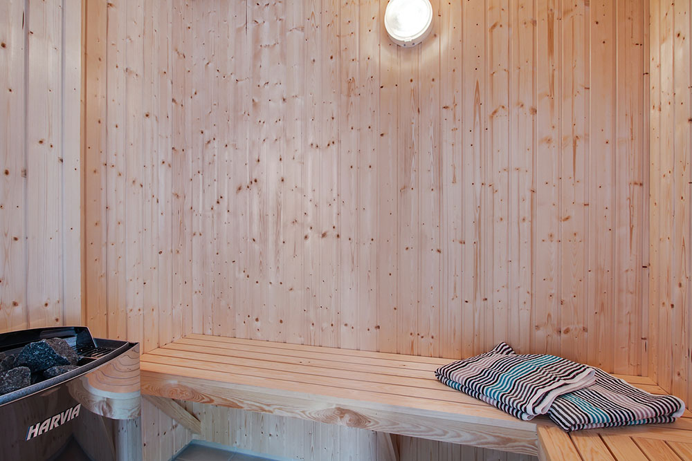 Genießen Sie die heiße Sauna im Luxusferienhaus Nr. 714 für 24 Personen