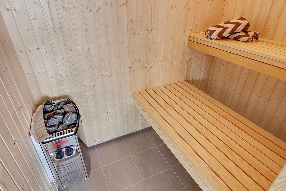 Genießen Sie die heiße Sauna im Luxusferienhaus Nr. 399 für 18 Personen