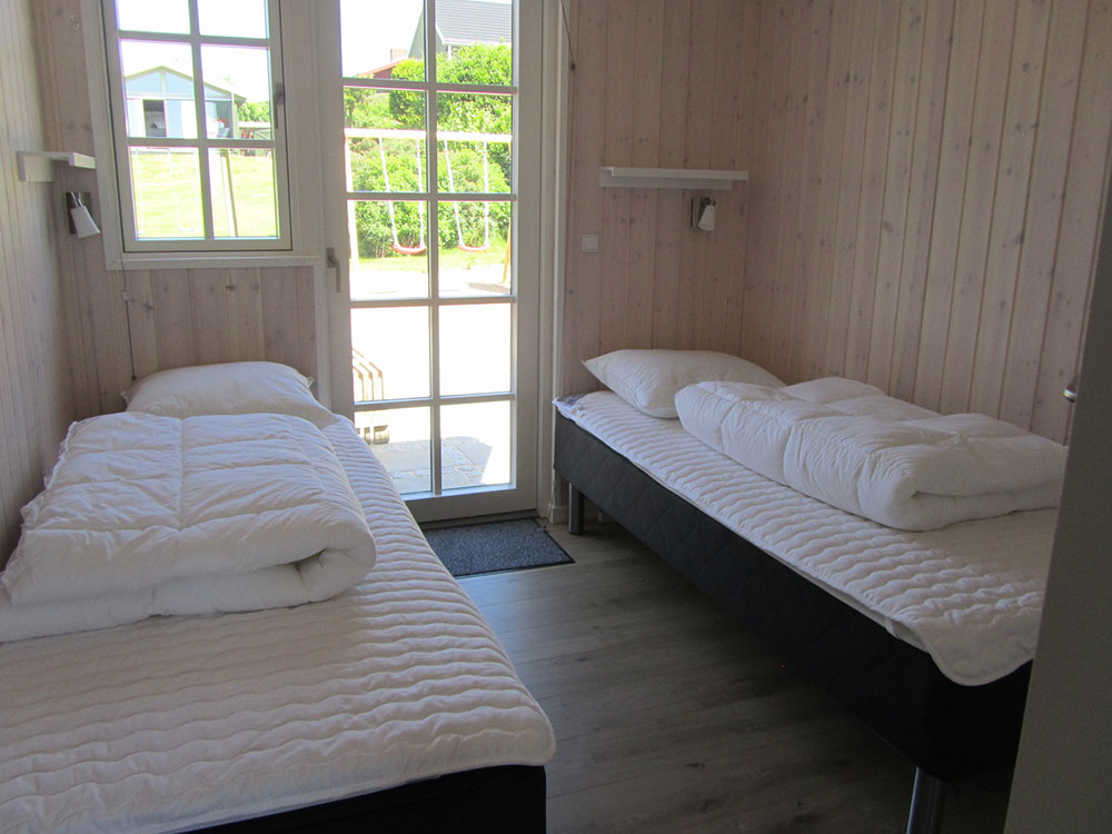 Eines der 9 Schlafzimmer im Luxusferienhaus Nr. 400