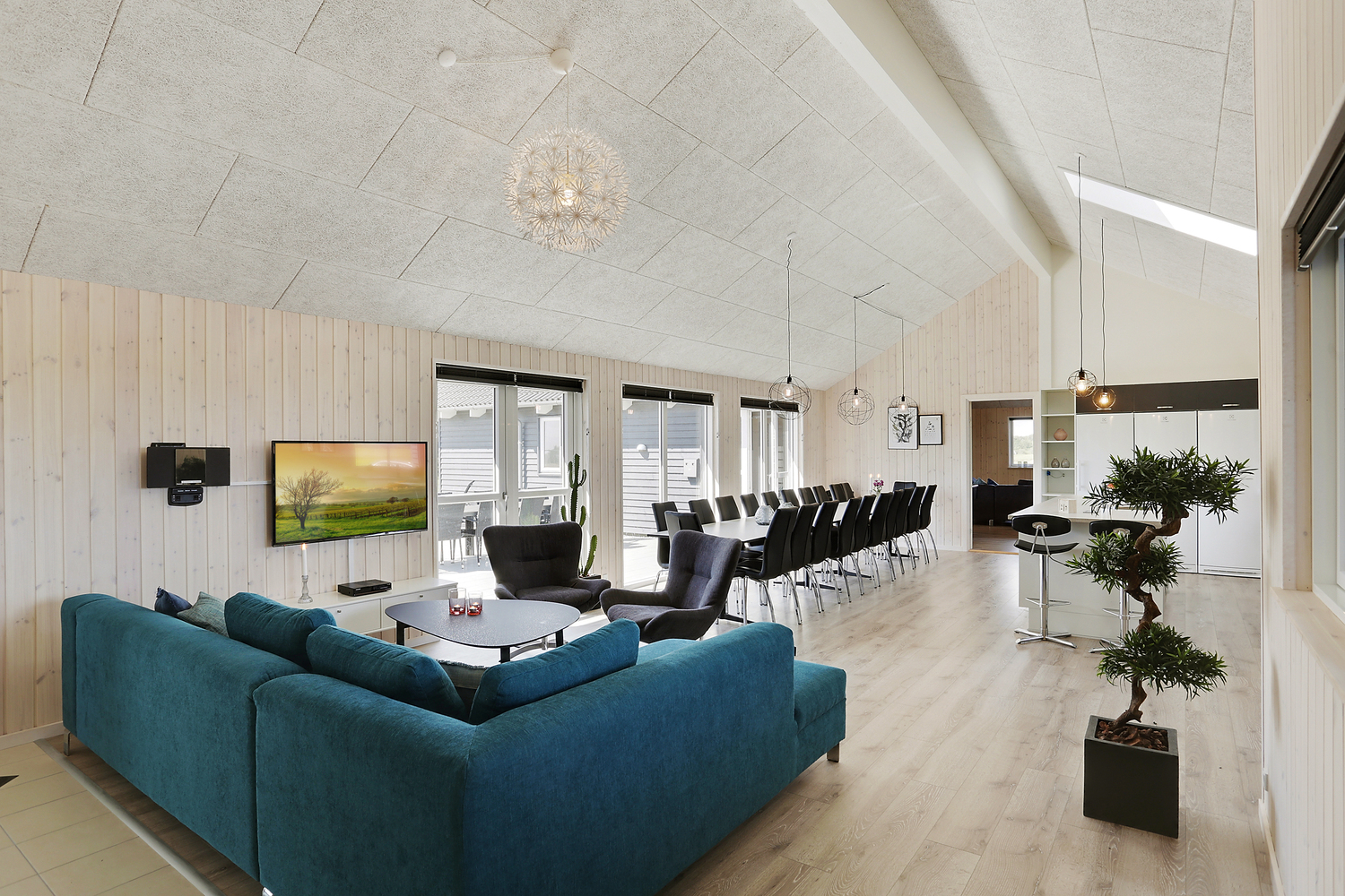 Aufenthaltsraum mit Platz für 24 im Luxusferienhaus Nr. 404.