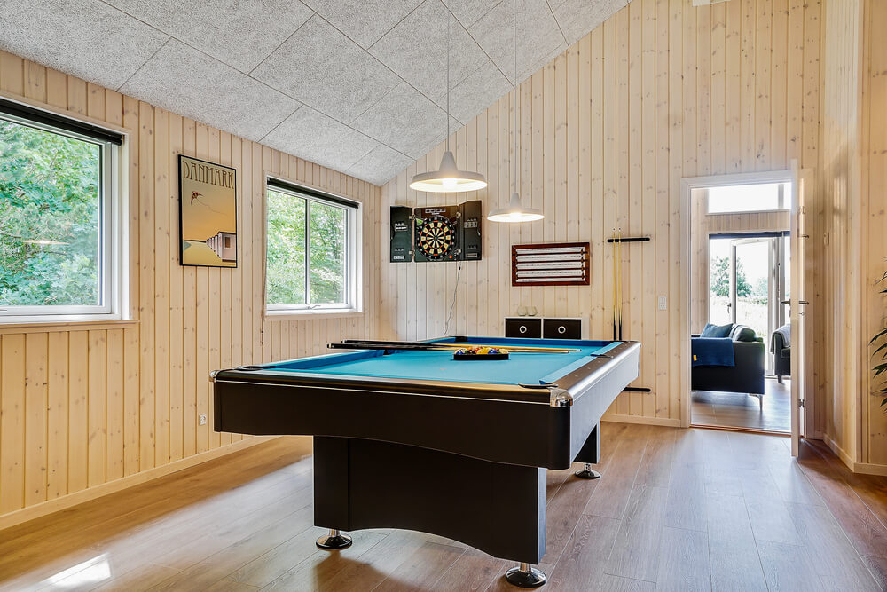 Neben den vielen schönen Stunden, die man im Poolbereich des Hauses verbringen kann, bietet das Luxusferienhaus 416 auch Spielevergnügen bei Billard/Tischtennis und Darts