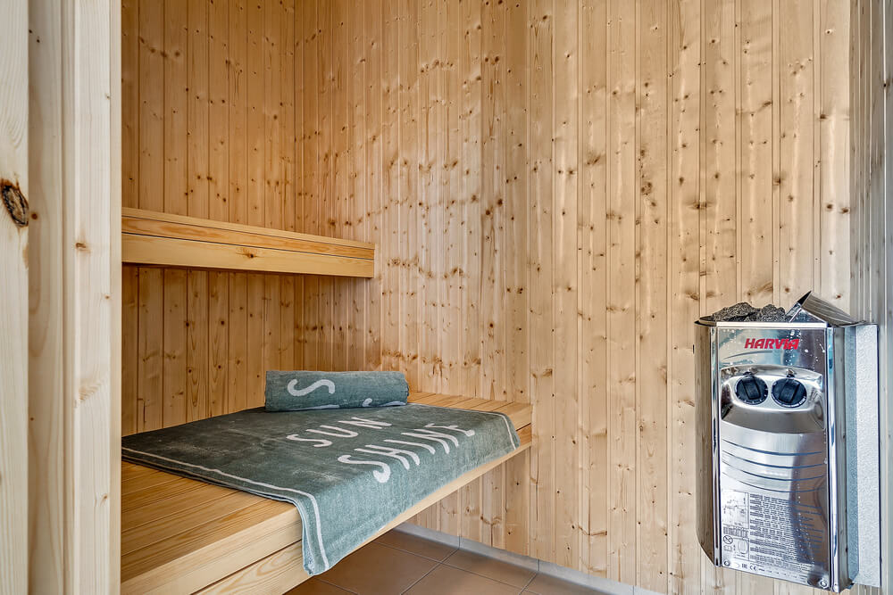 Genießen Sie die heiße Sauna im Luxusferienhaus Nr. 416 für 16 Personen