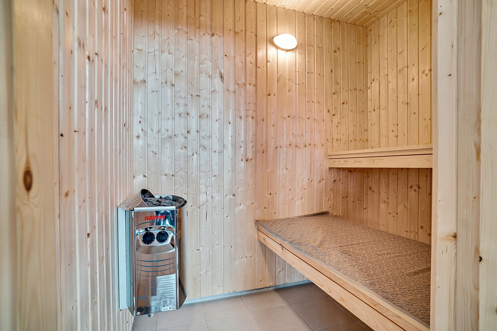 Genießen Sie die heiße Sauna im Luxusferienhaus Nr. 425 für 16 Personen