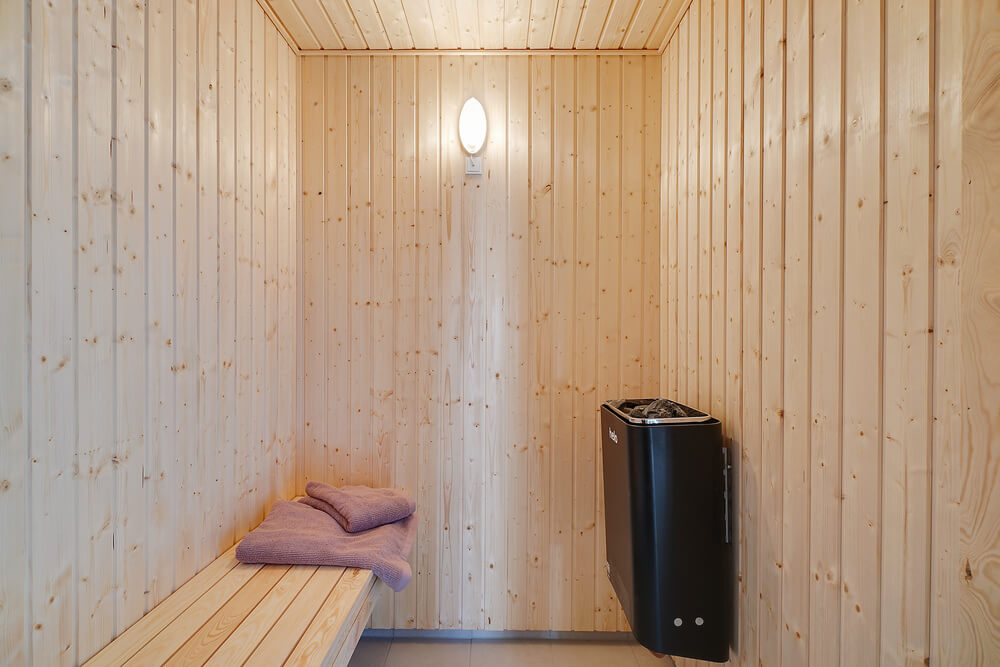 Genießen Sie die heiße Sauna im Luxusferienhaus Nr. 450 für 30 Personen