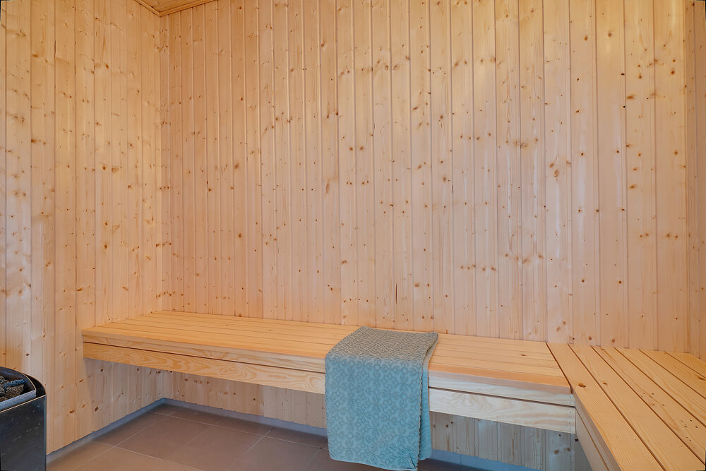 Genießen Sie die heiße Sauna im Luxusferienhaus Nr. 454 für 30 Personen