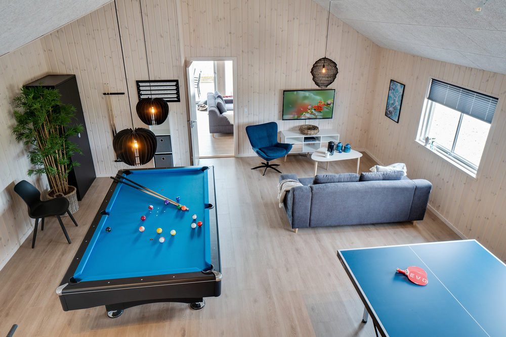 Neben den vielen schönen Stunden, die man im Poolbereich des Hauses verbringen kann, bietet das Luxusferienhaus 456 auch Spielevergnügen bei Billard/Tischtennis und Darts
