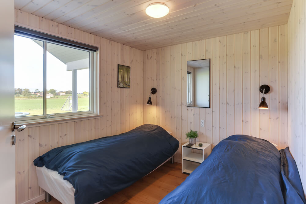 Eines der 9 Schlafzimmer im Luxusferienhaus Nr. 447