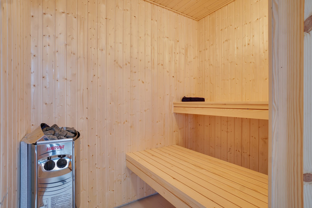 Genießen Sie die heiße Sauna im Luxusferienhaus Nr. 449 für 18 Personen