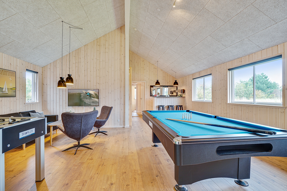 Neben den vielen schönen Stunden, die man im Poolbereich des Hauses verbringen kann, bietet das Luxusferienhaus 472 auch Spielevergnügen bei Billard/Tischtennis und Darts