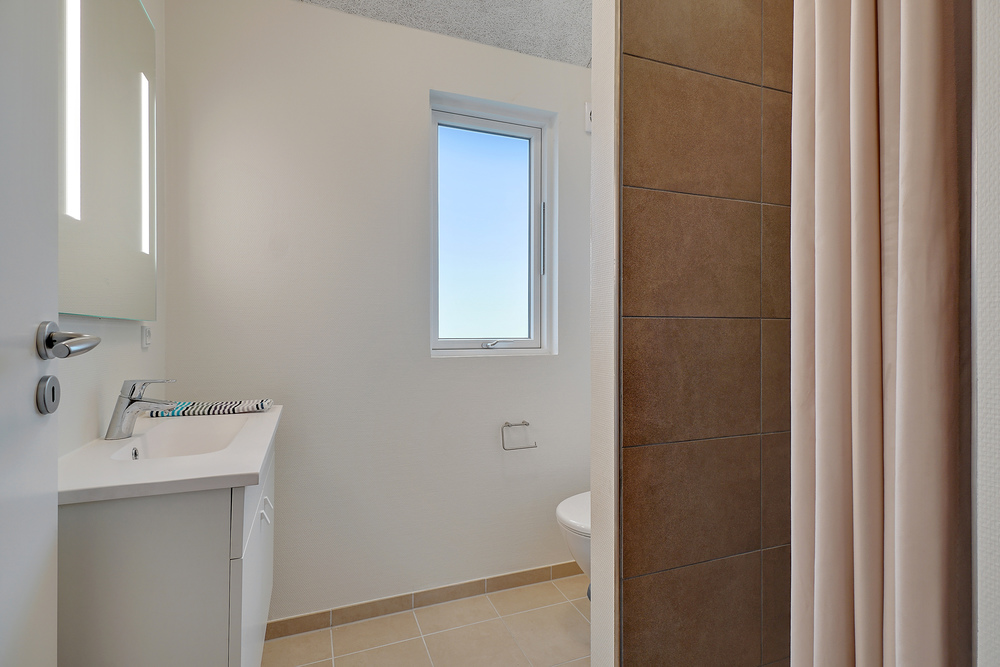 Eines der Badezimmer im Luxusferienhaus Nr. 474
