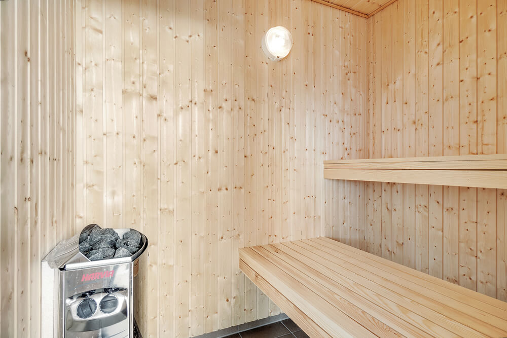 Genießen Sie die heiße Sauna im Luxusferienhaus Nr. 464 für 16 Personen