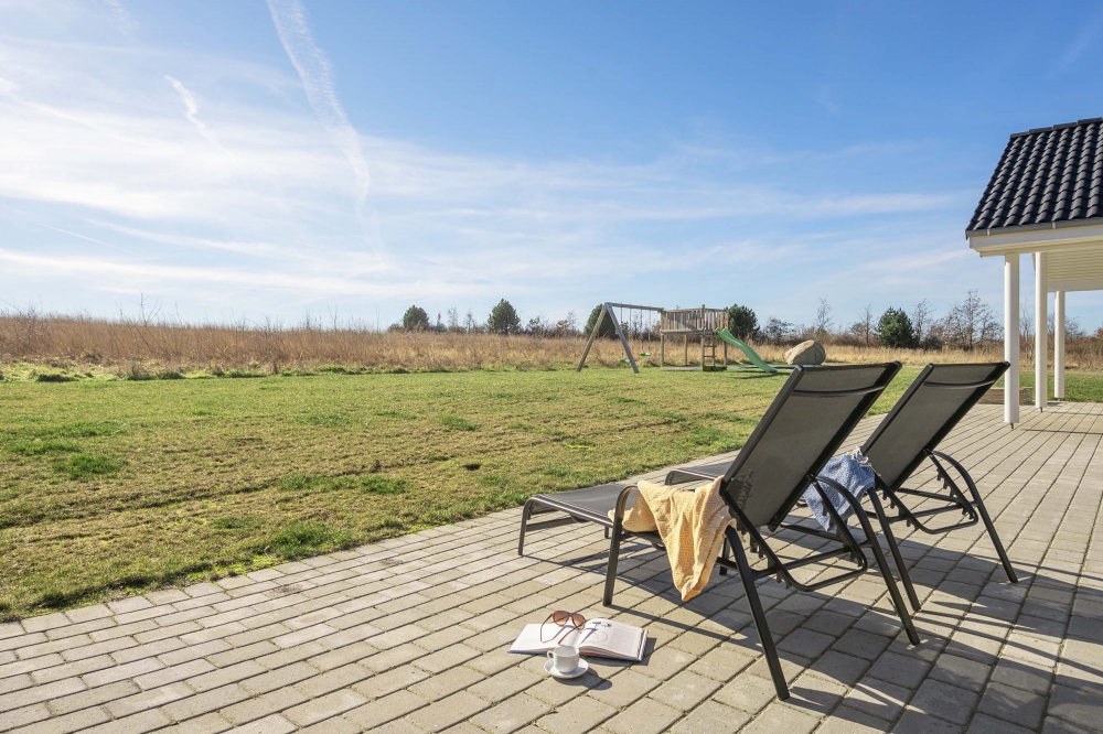 Genießen Sie einen Grillabend auf der Terrasse des Luxusferienhauses Nr. 479 in Ostjütland