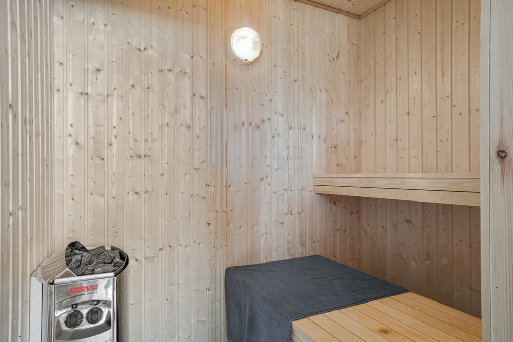 Genießen Sie die heiße Sauna im Luxusferienhaus Nr. 492 für 18 Personen