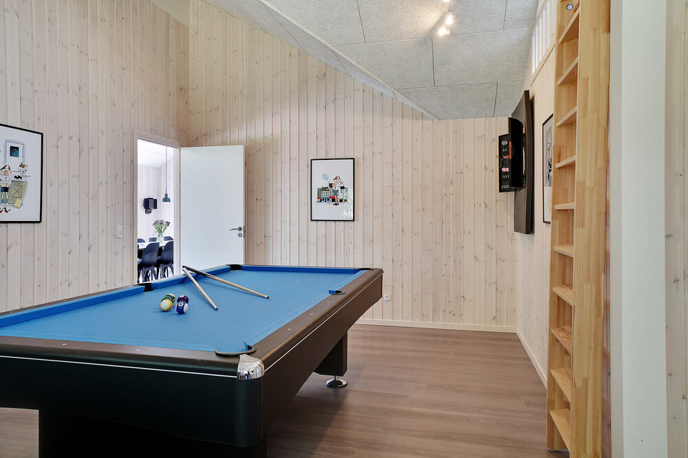 Neben den vielen schönen Stunden, die man im Poolbereich des Hauses verbringen kann, bietet das Luxusferienhaus 519 auch Spielevergnügen bei Billard/Tischtennis und Darts