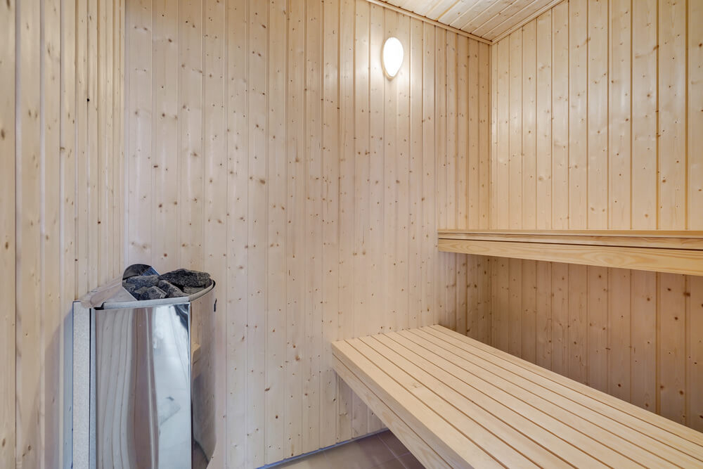 Genießen Sie die heiße Sauna im Luxusferienhaus Nr. 509 für 16 Personen