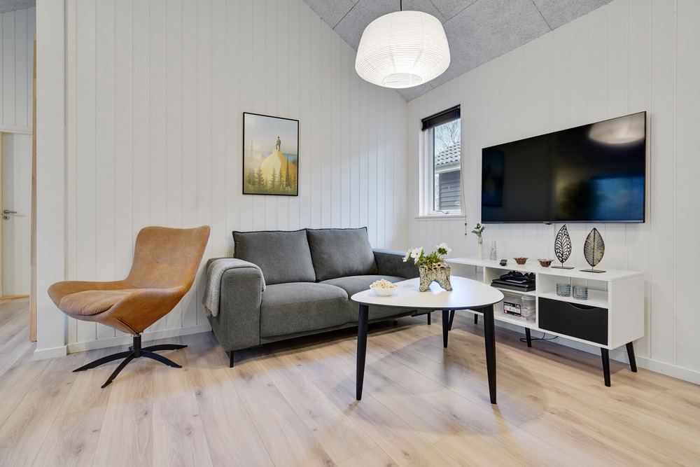 Die Couch im Luxusferienhaus Nr. 517 in Lolland/Falster/Mön lädt zu Gesellschaftsspielen oder zu Kinoabenden ein.