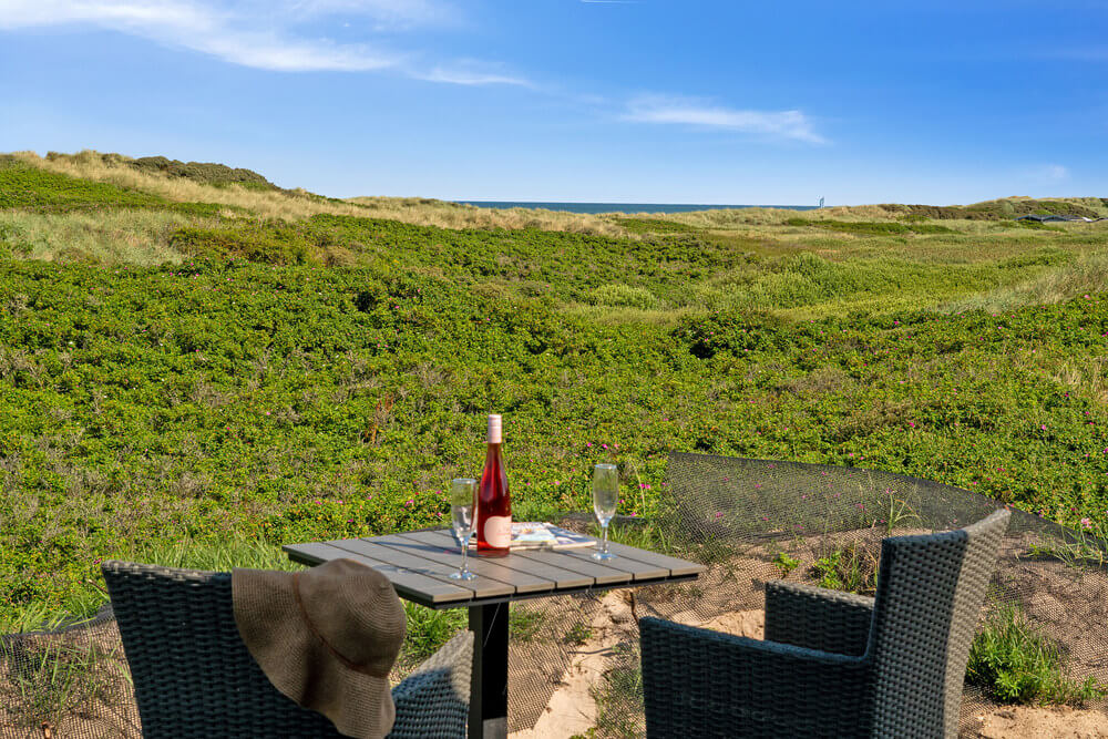 Genießen Sie einen Grillabend auf der Terrasse des Luxusferienhauses Nr. 514 in Nordjütland