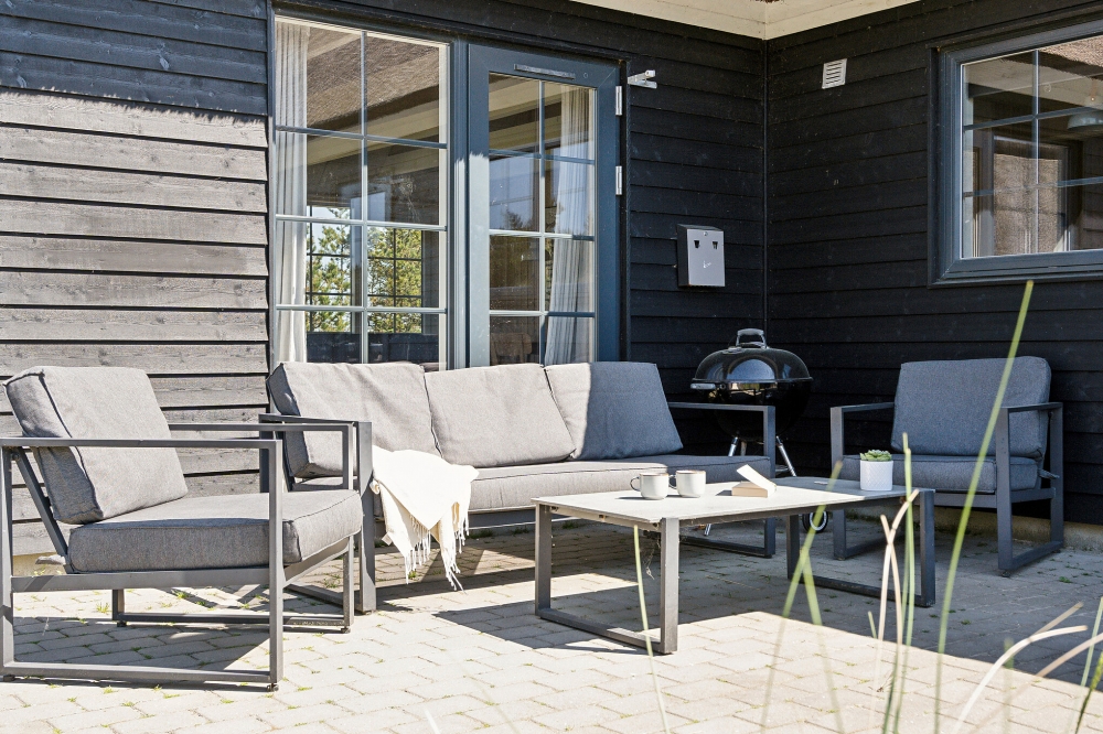 Genießen Sie einen Grillabend auf der Terrasse des Luxusferienhauses Nr. 518 in Westjütland