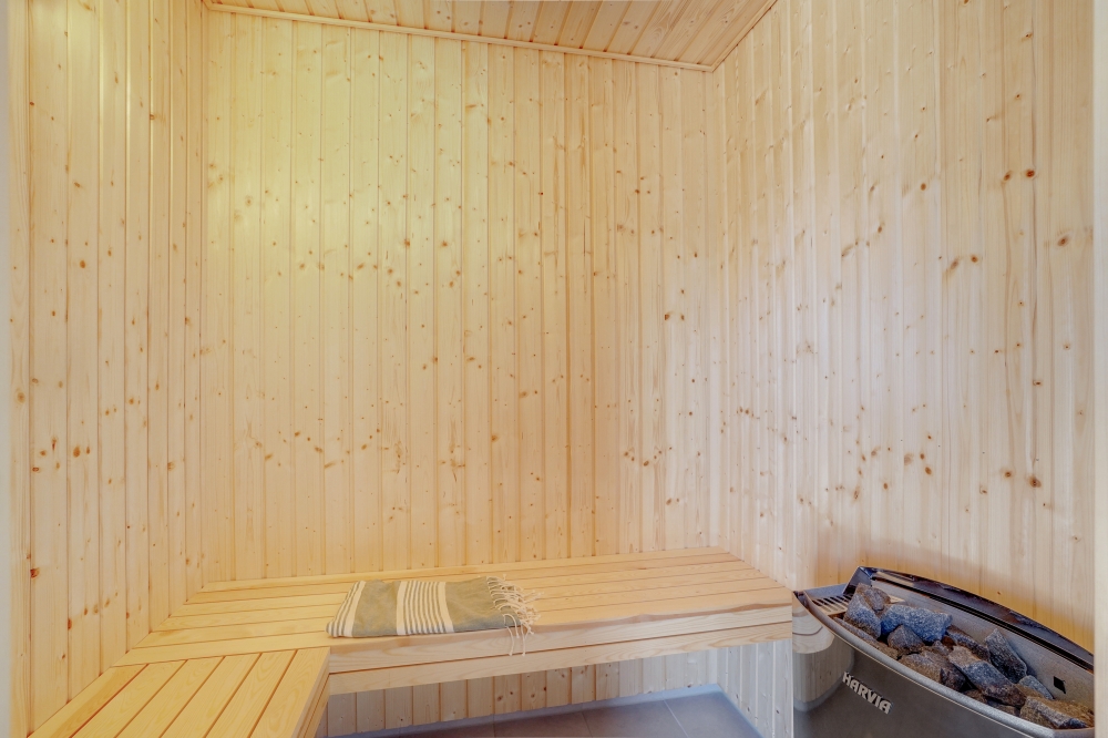 Genießen Sie die heiße Sauna im Luxusferienhaus Nr. 542 für 26 Personen