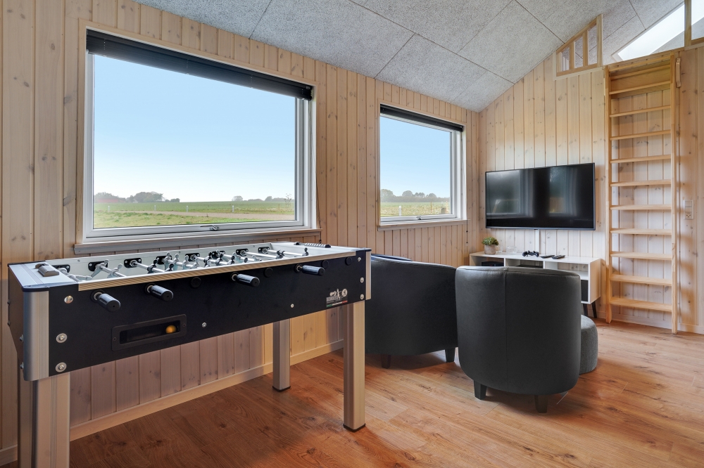 Aktivitätsraum im Luxusferienhaus Nr. 544 mit 5 Schlafzimmern und Platz für 14 Gäste.
