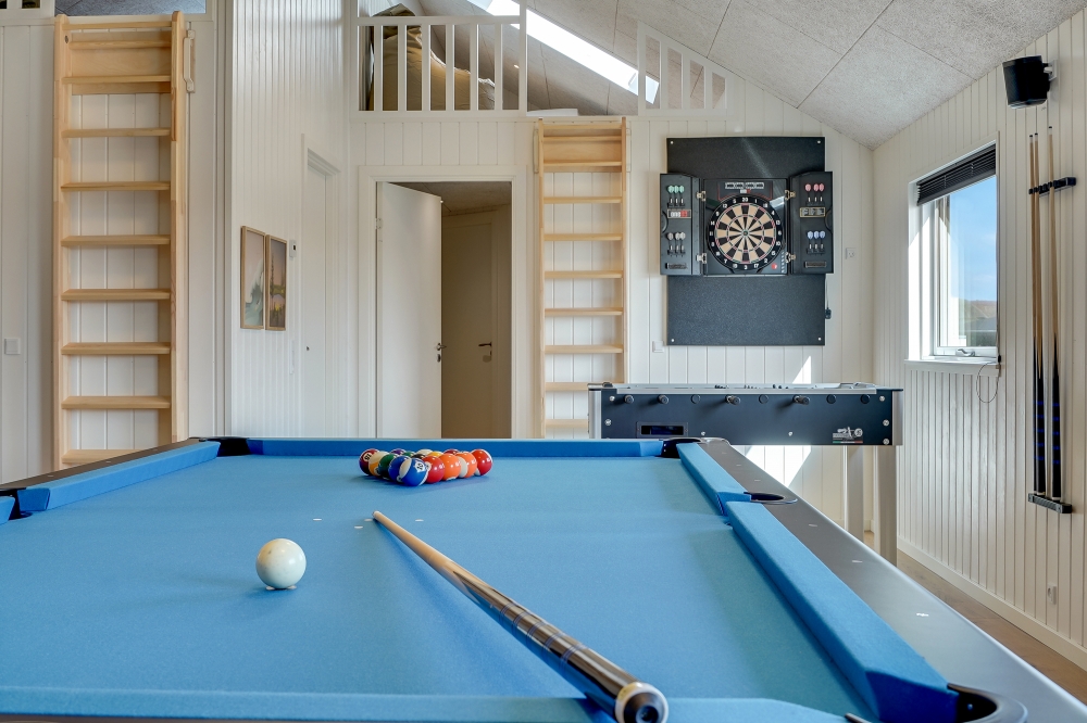 Neben den vielen schönen Stunden, die man im Poolbereich des Hauses verbringen kann, bietet das Luxusferienhaus 558 auch Spielevergnügen bei Billard/Tischtennis und Darts