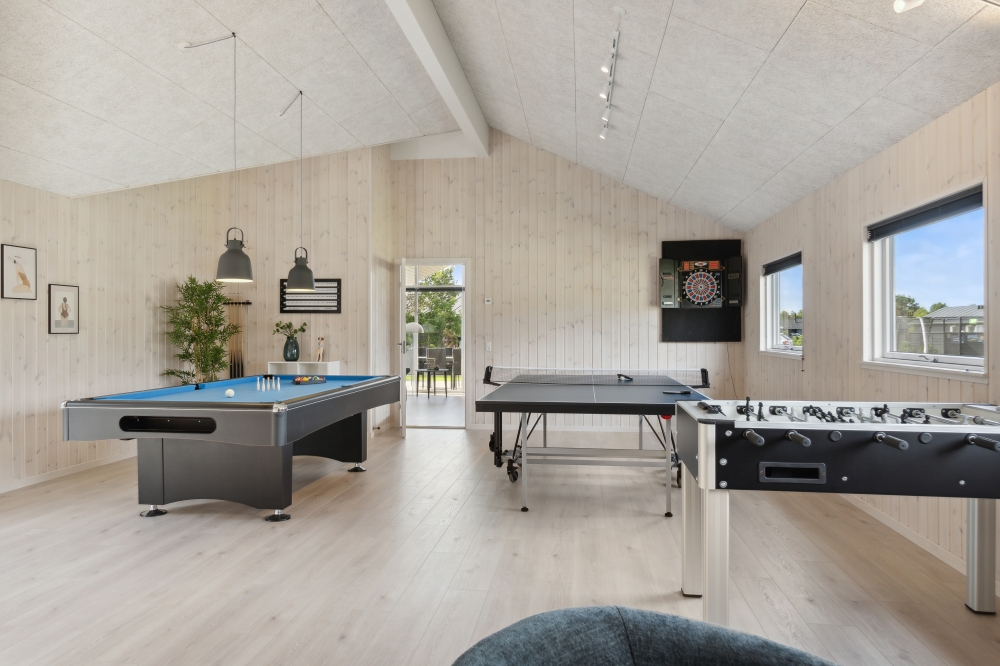 Neben den vielen schönen Stunden, die man im Poolbereich des Hauses verbringen kann, bietet das Luxusferienhaus 577 auch Spielevergnügen bei Billard/Tischtennis und Darts