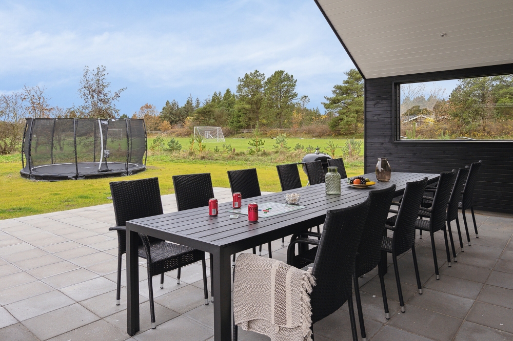 Genießen Sie einen Grillabend auf der Terrasse des Luxusferienhauses Nr. 596 in Südjütland