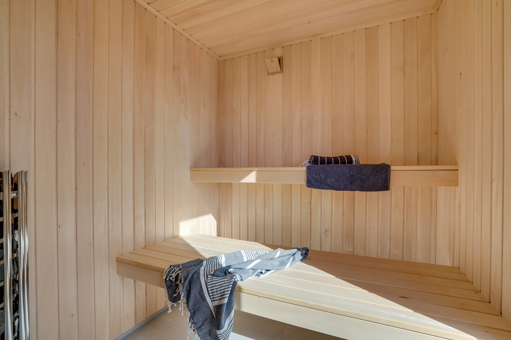 Genießen Sie die heiße Sauna im Luxusferienhaus Nr. 597 für 18 Personen