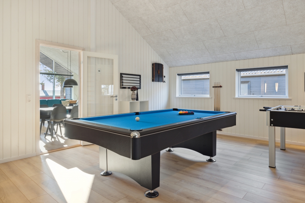 Neben den vielen schönen Stunden, die man im Poolbereich des Hauses verbringen kann, bietet das Luxusferienhaus 753 auch Spielevergnügen bei Billard/Tischtennis und Darts