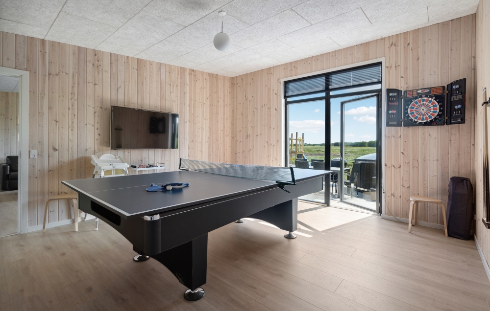 Neben den vielen schönen Stunden, die man im Poolbereich des Hauses verbringen kann, bietet das Luxusferienhaus 604 auch Spielevergnügen bei Billard/Tischtennis und Darts