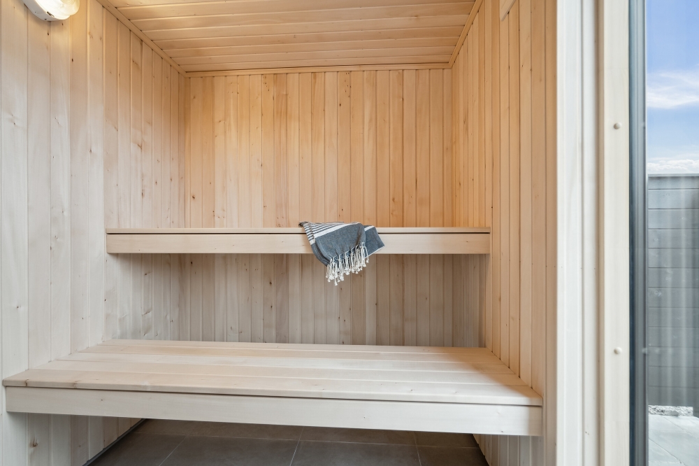 Genießen Sie die heiße Sauna im Luxusferienhaus Nr. 610 für 18 Personen