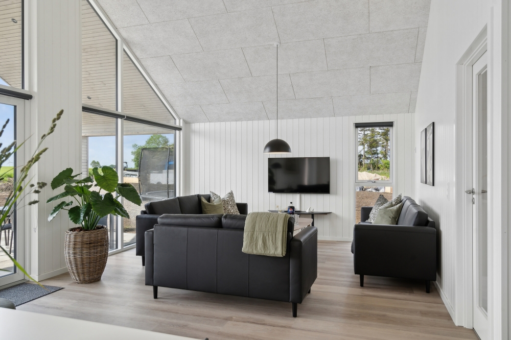 Die Couch im Luxusferienhaus Nr. 614 in Fünen und seine Inseln lädt zu Gesellschaftsspielen oder zu Kinoabenden ein.
