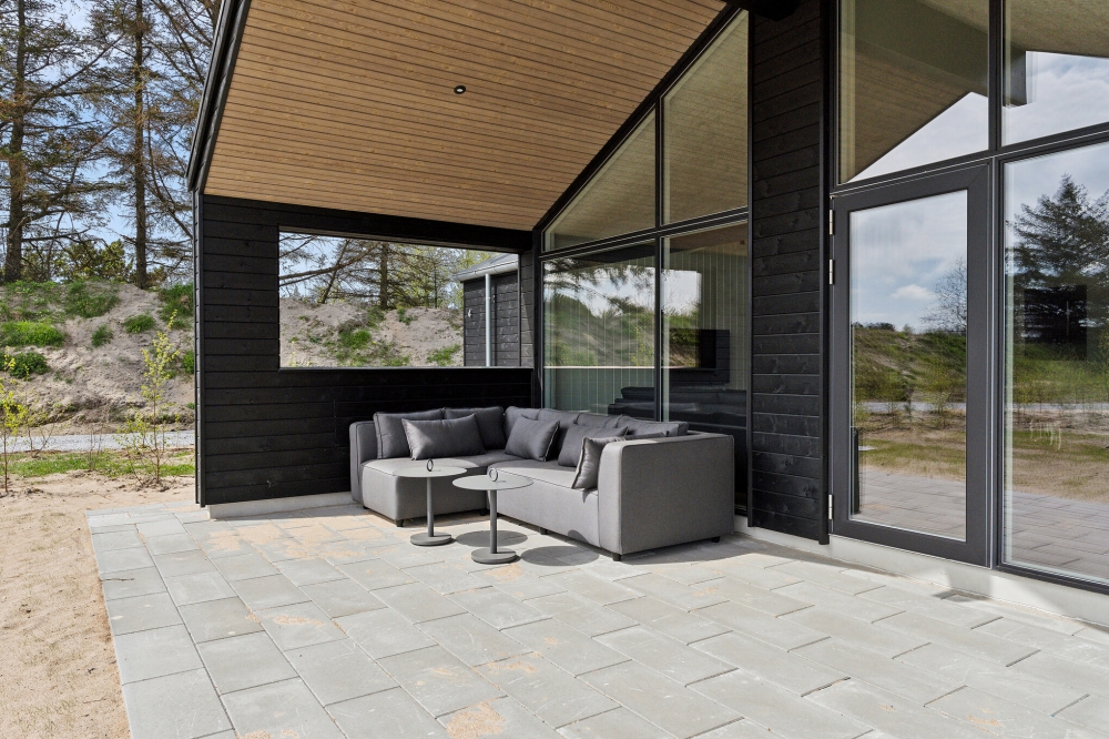 Genießen Sie einen Grillabend auf der Terrasse des Luxusferienhauses Nr. 615 in Nordjütland
